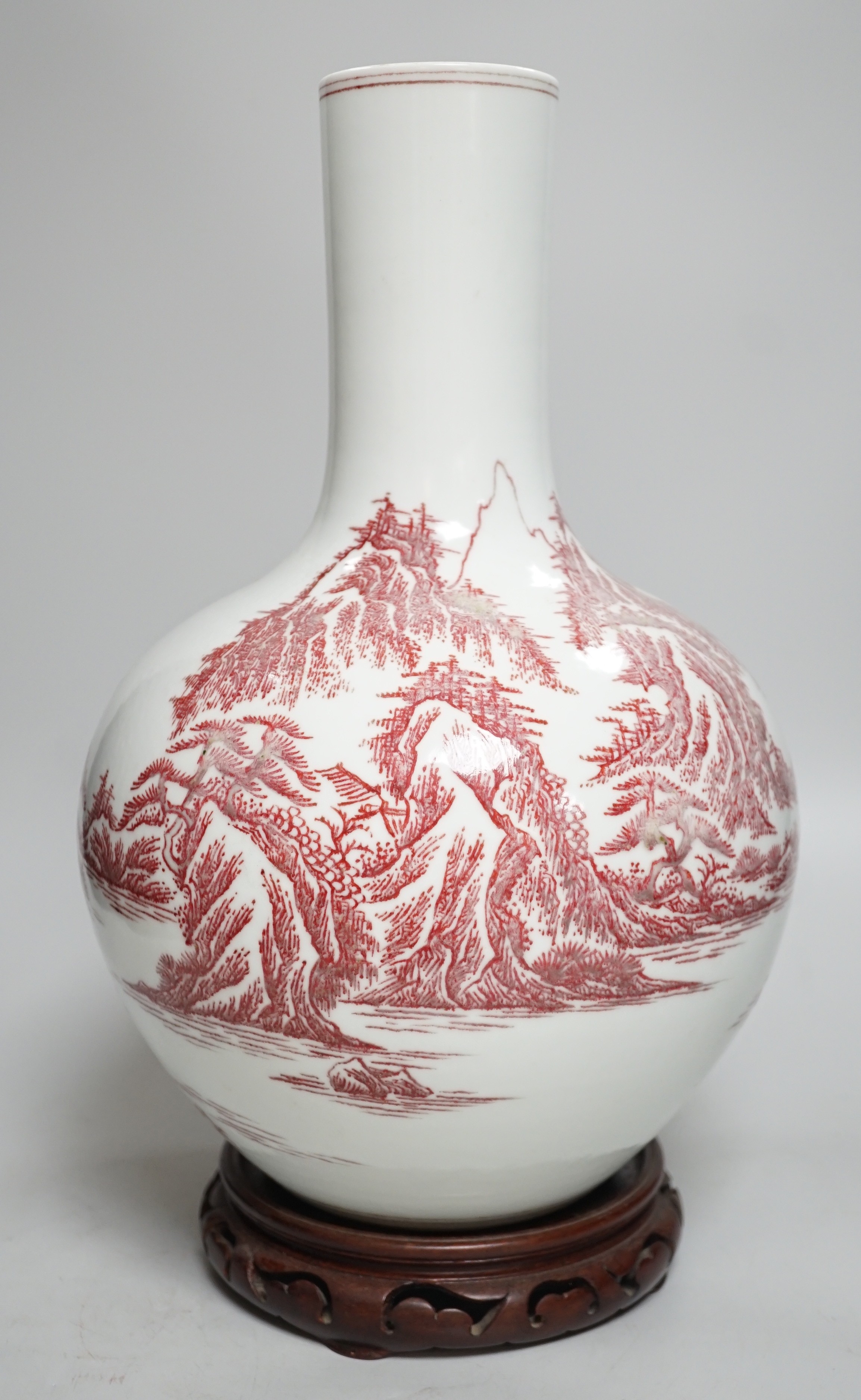 A large Chinese underglaze copper read landscape vase on hardwood stand, 40cm total